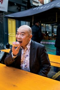 Dr Giles Yeo eating a donut