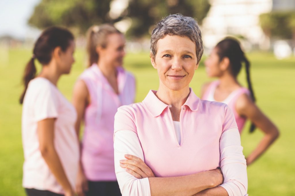 Woman in pink with arms crossed