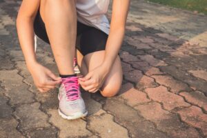 Tying up running shoes for exercise